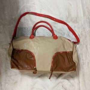 Steve Madden weekender/duffle bag. Tan with red trim.
